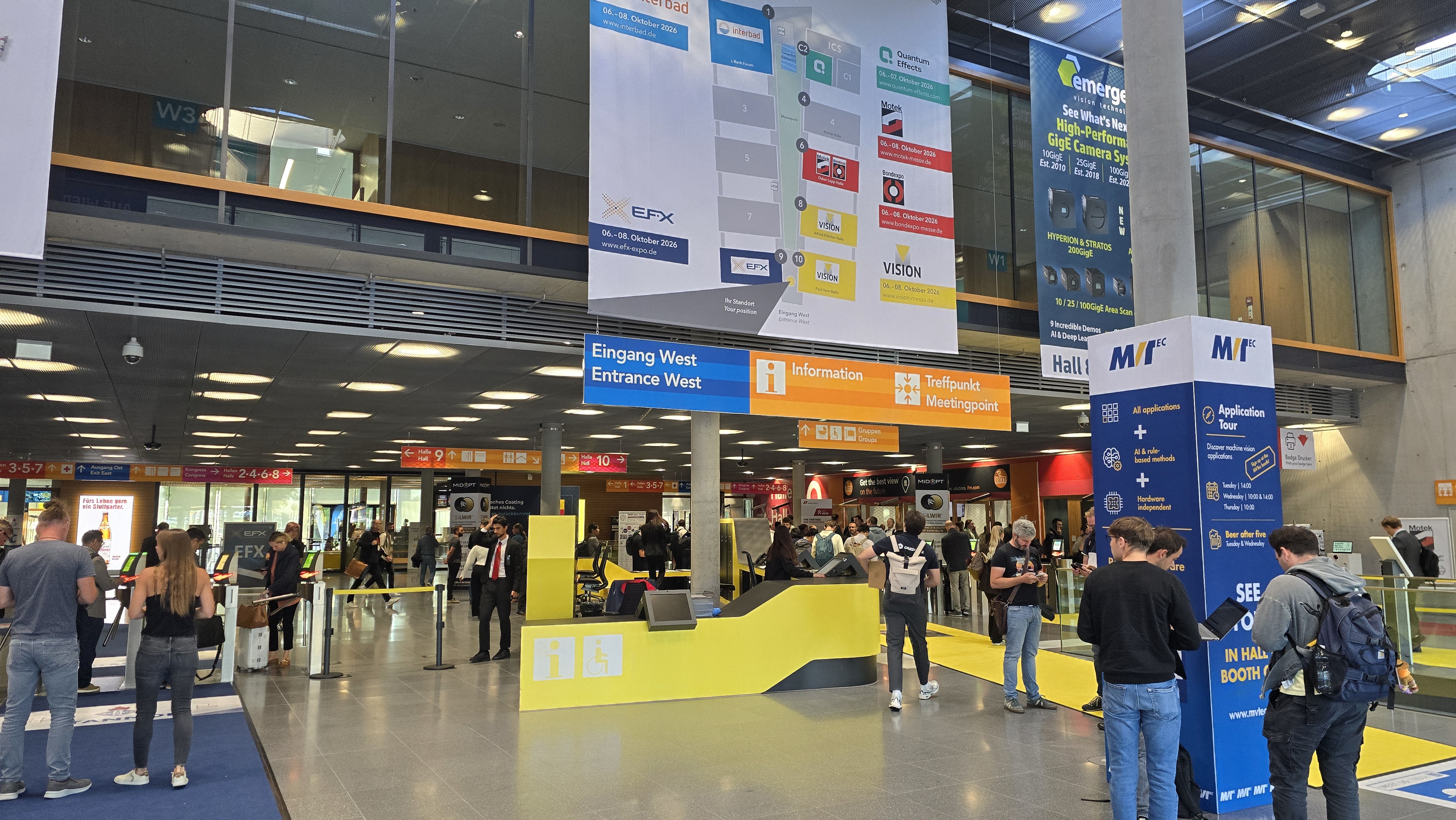 Visitors entering through the West entrance hall of Messe Stuttgart during VISION 2026