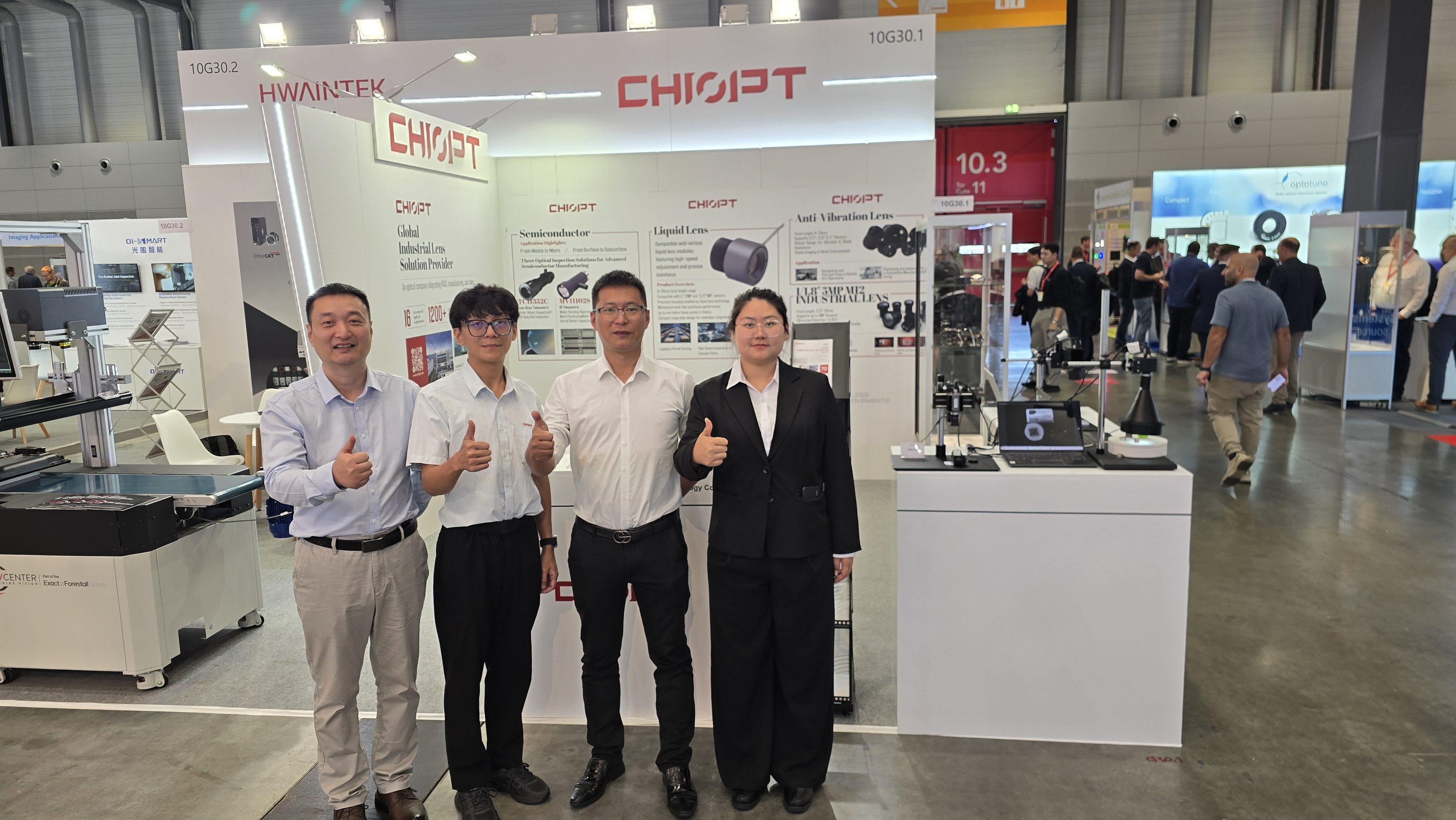 The CHIOPT team in front of the product wall at VISION 2026, Messe Stuttgart, Hall 10 Booth 10G30.1